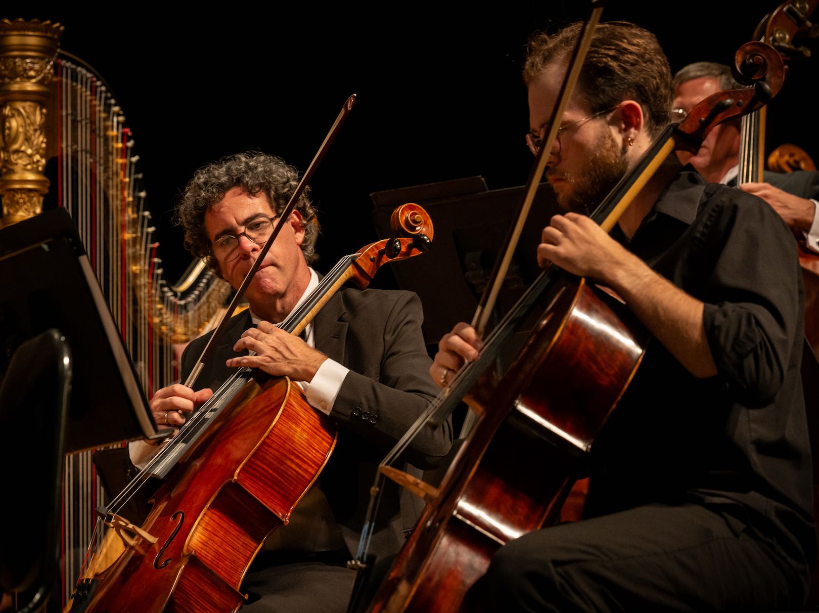 Cellos in formation during performance.